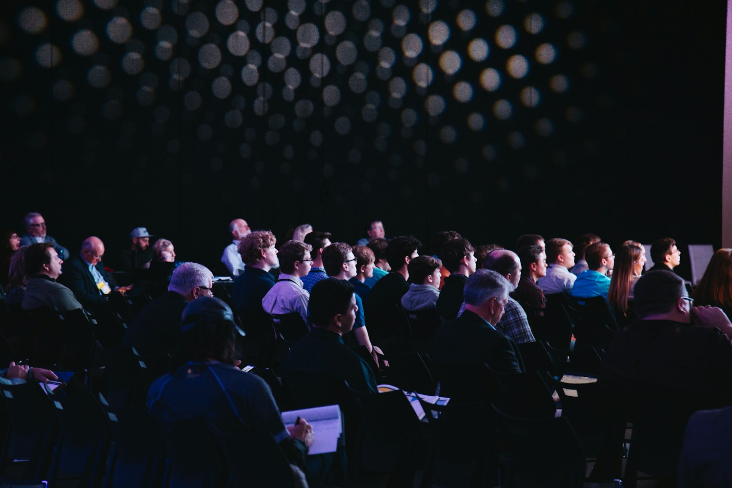 An audience sharing ideas at a conference